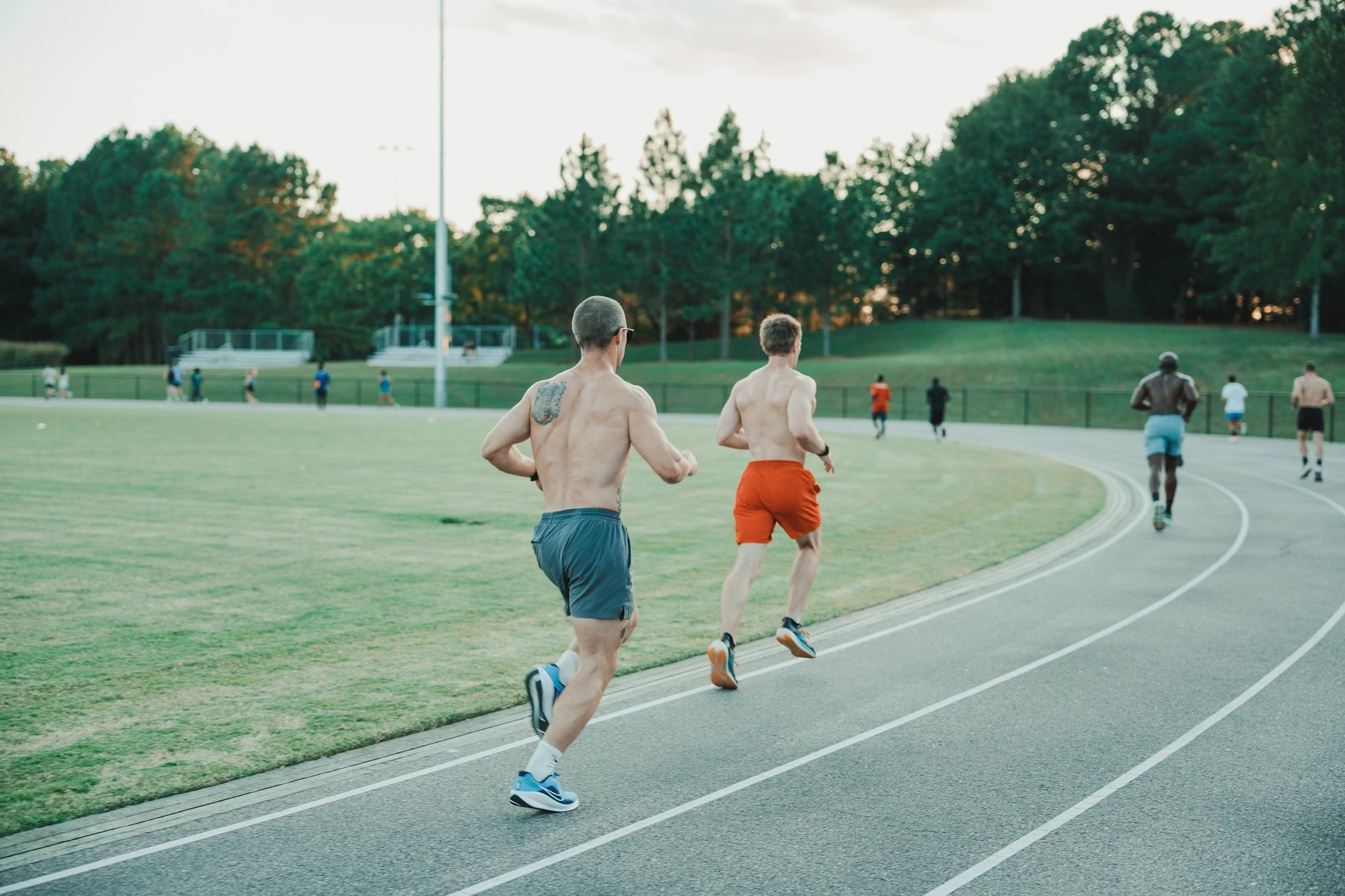 Members running a track workout